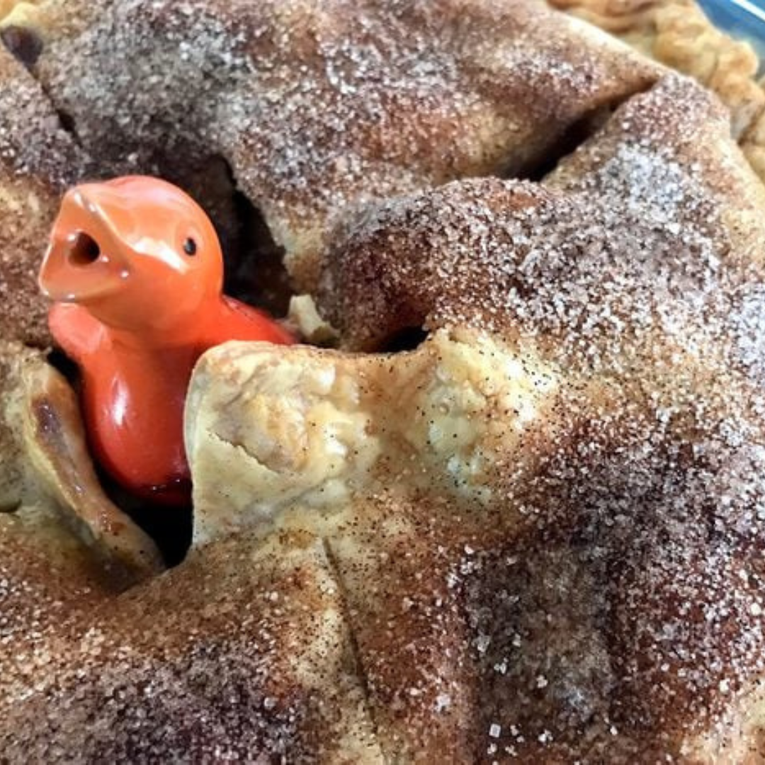 Orange pie bird in an apple pie