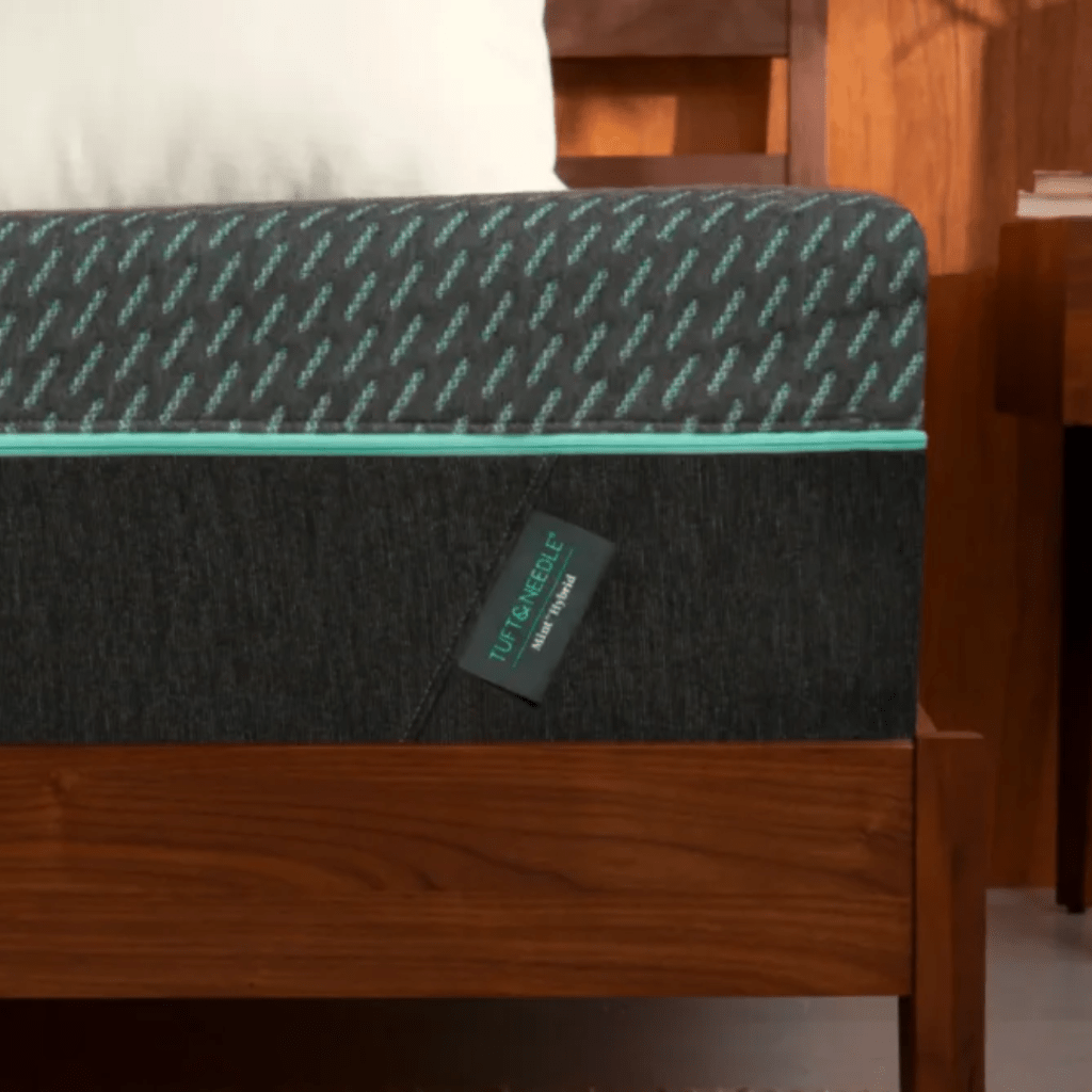 Tuft & Needle Mint Hybrid Mattress on a bed frame